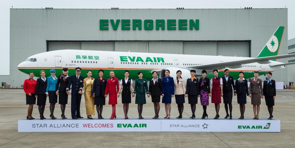 Staff representatives from Star Alliance airlines join hands in front of an EVA Air Boeing 777-300 ER to welcome the Taiwanese carrier into the Star Alliance family. EVA Air, which joined Star Alliance on June 18, 2013, is part of Taiwan's Evergreen group.
