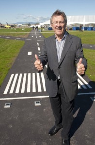 Larry Berg, former president and CEO Vancouver Airport Authority, gives the thumbs-up at the September 27, 2013 opening of the new and improved Larry Berg Flight Path.