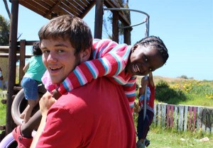 A Projects Abroad volunteer and a local child during playtime at a Care placement in Cape Town, South Africa.