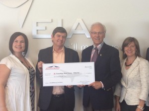 (Left to right): Raelyn Kruitbosch, EIA Real Estate Development Manager; Tom Ruth, EIA president & CEO; Wayne Duzita, Aeroterm associate VP Western Region; Traci - EIA VP passenger market development.