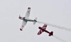 Father-son duo Bud and Ross Granley perform displays in Soviet aerobatic aircraft--Yak 18T Dual (white) and red Yak-SS. Photo: Jim Jorgenson